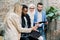 Business professionals. Group of young multiethnic confident business people analyzing data using laptop computer while