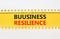 Business resilience symbol. Concept word Business resilience typed on yellow and white paper. Beautiful yellow and white