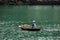 Business on rowboat in the Halong Bay of Vietnam