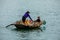 Business on rowboat in the Halong Bay of Vietnam