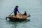 Business on rowboat in the Halong Bay of Vietnam