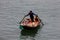 Business on rowboat in the Halong Bay of Vietnam