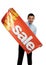 Business or salesman holding Sale Banner