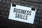 business skills inscription on white paper note on laptop keyboard. Closeup message