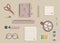 Business stationery in soft colours. Beige khaki and lilac colours.Notebook with kawaii birds and  pencil and mobile phone and