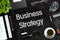 Business Strategy - Text on Black Chalkboard. 3D Rendering.