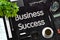 Business Success Concept on Black Chalkboard. 3D Rendering.