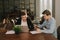 Business team young men talking strategy with laptop in modern office