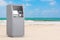 Business Technology Concept. ATM Deposit Machine on an Ocean or Sea Sand Beach. 3d Rendering