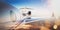 Business travel concept.Generic design of white luxury private jet flying in blue sky at sunset.Uninhabited desert