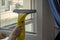 Business window cleaning and cleaning of offices and apartments. Wash the window at home with a battery wiper. The apparatus yello