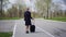 A business woman approaches a public transport stop