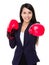 Business woman boxing punching towards camera