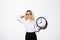 Business woman with clock in hand remember something. Closeup portrait woman, worker, holding clock looking anxiously, pressured b