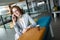 Business woman with coffe and talking on the phone in office