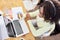 Business woman at the computer with notes for scheduling