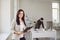 Business woman confident standing at a table in the workplace in the office