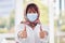 Business woman, covid and thumbs up for workplace compliance, corona virus health policy and muslim in face mask