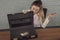 Business woman disappointed with the contents of the briefcase