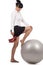 Business woman doing exercise with workout ball