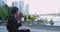 Business woman drinking coffee outside in downtown Vancouver Canada