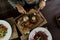 Business woman eating beef steak with butter on wooden table in a restaurant. Time for healthy lunch. Top view.