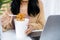 Business woman eating spicy noodles at work place sitting at office with notebook on desk , unhealthy lifestyle eating fast food