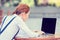 Business woman entrepreneur resting hands on keyboard looking on computer laptop screen