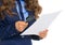 Business woman examining document using magnifying glass