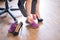 A business woman exchanges high heels for comfortable shoes in the workplace. A close-up of female hands takes off her