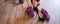 A business woman exchanges high heels for comfortable shoes in the workplace. A close-up of female hands takes off her