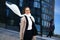 Business woman with glasses stands near the business center