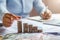 business woman hand holding coins to stack on desk concept saving money finance