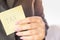 Business woman hand holding sticky note with word tax