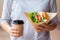 Business woman having lunch, Burger with coffee on time break