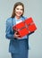 Business woman hold gift. Beautiful girl business suit dressed.