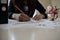 Business woman holding a pencil is working with graph on the desk related to business functions.