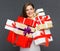 Business woman holding pile, stack, heap of presents