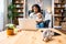 Business woman on maternity leave. Mother with newborn baby working from home using laptop. Female professional work at home