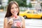 Business woman in New York eating watermelon snack