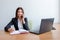 Business woman with notebook, calendar and mobile phone at work.