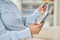 Business woman online shopping with a credit card and phone while on a break in corporate office. Closeup of a girl