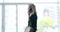 Business woman, phone call and walk in corridor at office with blurred background with mock up space at job