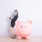 Business woman with piggy bank