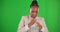 Business woman, portrait and strong on green screen with fist to fight and mockup. Face of professional, young and