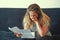 Business woman reading a document in office workspace