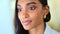 Business woman reading information on a computer screen while working in an office. Closeup on face of one confident