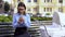 Business woman sending email on smartphone ignoring baby in carriage, career