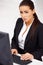 Business woman sitting in front of computer monitor