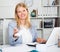 Business woman sitting giving white sticker